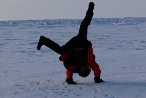 day-5-2 Doug doing a headstand at the North Pole